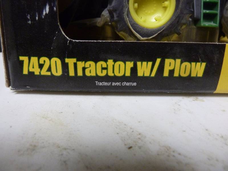 lot 303 image: John Deere 7420 with Plow