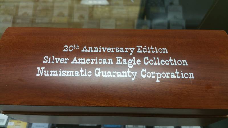 GROUP OF NGC CERTIFIED US SILVER EAGLES 1986-2005 IN WOODEN BOX (20 COINS)