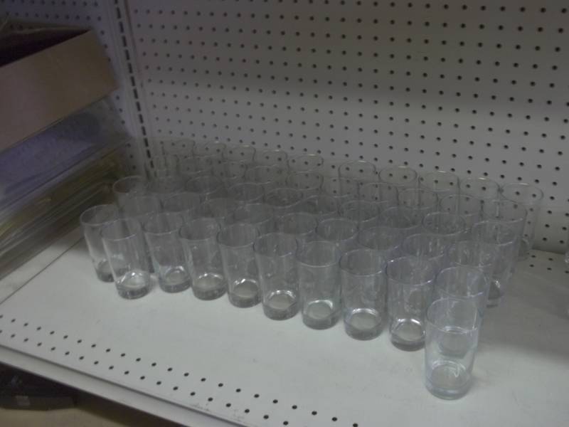 lot 50 image: 21 Shot glasses  51 8 ounce glasses 4 10 oz glasses