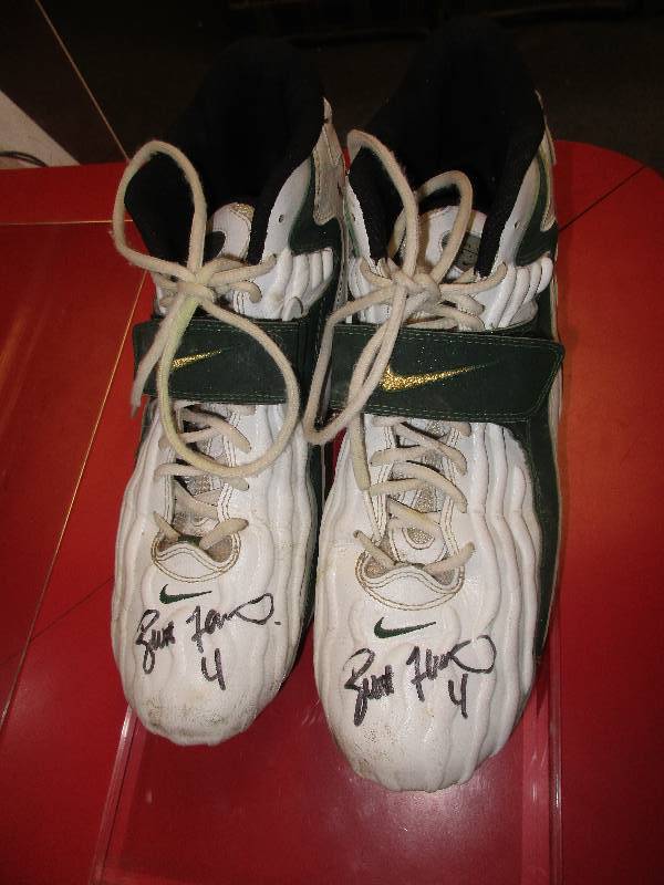 Brett Farve game wore and signed shoes - with certificate of authenticity and picture of Brett signing the shoes - all in protective display box