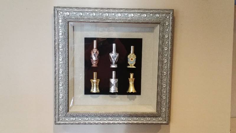 lot 32 image: Framed Ornate Perfume Bottle Collection