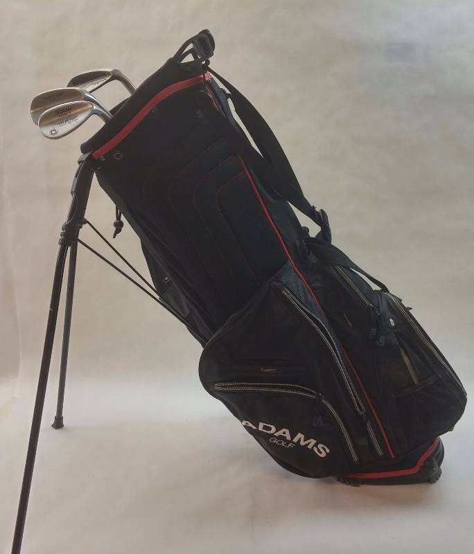 lot 15 image: Adams Golf Dual Strap Stand Gold Bag w 3 Misc clubs