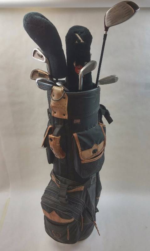 lot 16 image: Datrek Golf Bag with 12 non matching Golf Clubs