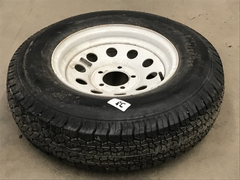 lot 38 image: (1) 5-Lug Trailer Wheel With ST205...