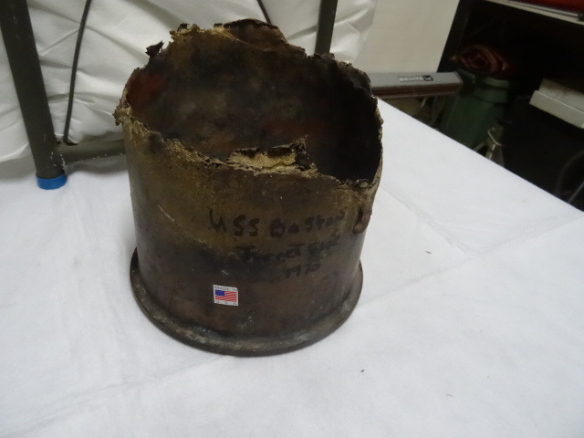 Melted brass shell from USS Boston ...