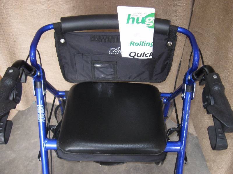 lot 82 image: Elite Blue Walker Chair with Seat and Saddle Bag