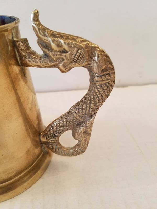 lot 23 image: Solid Brass Mug with A Sea Serpent Handle