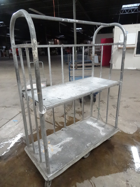 lot 65 image: 4 wheel aluminum 2 tier cart. Top s...