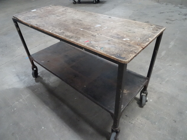 lot 82 image: 2 tier 4 wheel table on wheels. 61 ...