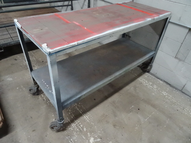 lot 106 image: 4 wheel metal framed table on wheel...