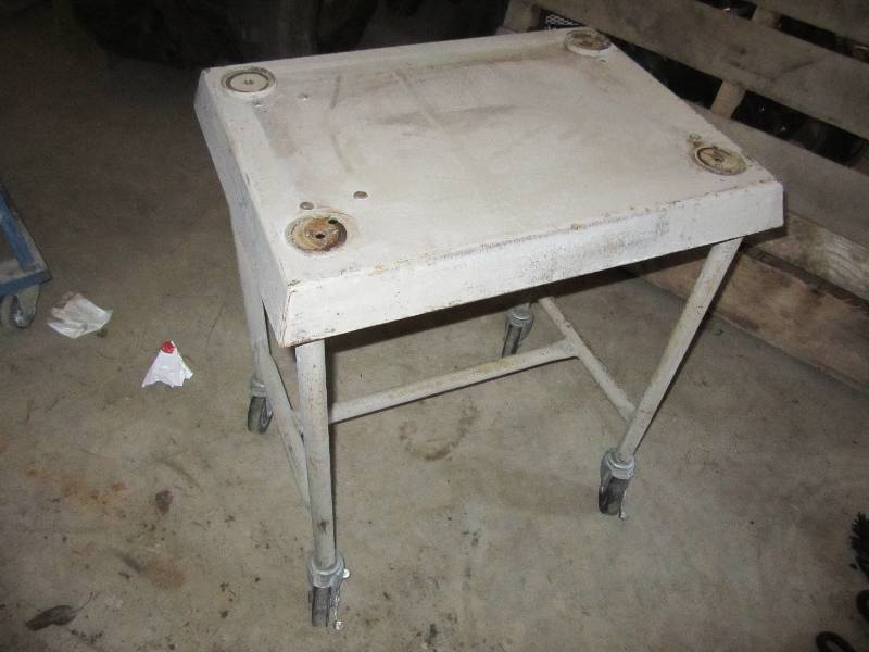 lot 18 image: Metal table on wheels...