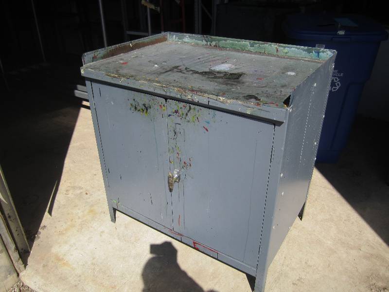 lot 36 image: Metal work table with cabinet below...