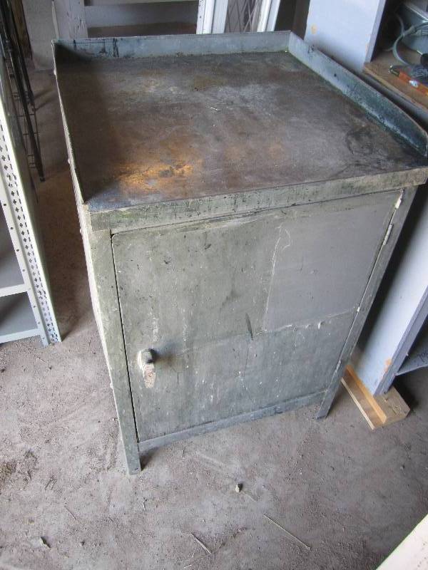 lot 39 image: Metal work table with cabinet below...