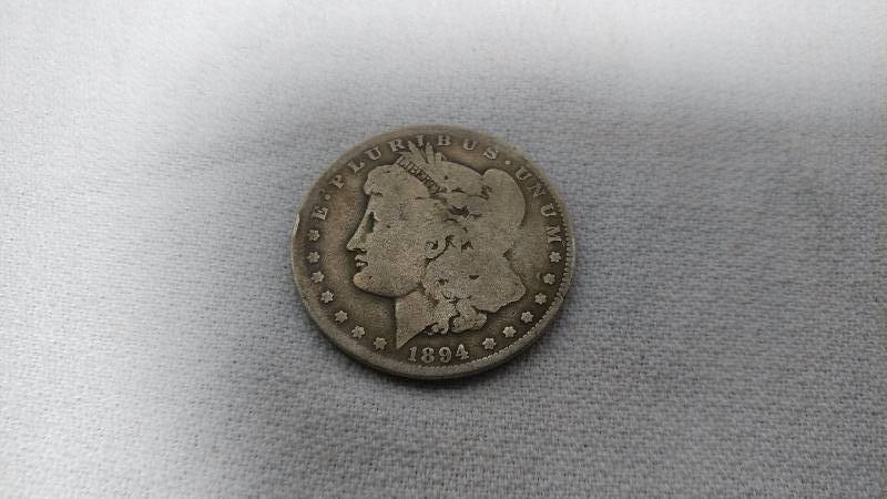 1894-S MORGAN SILVER DOLLAR...