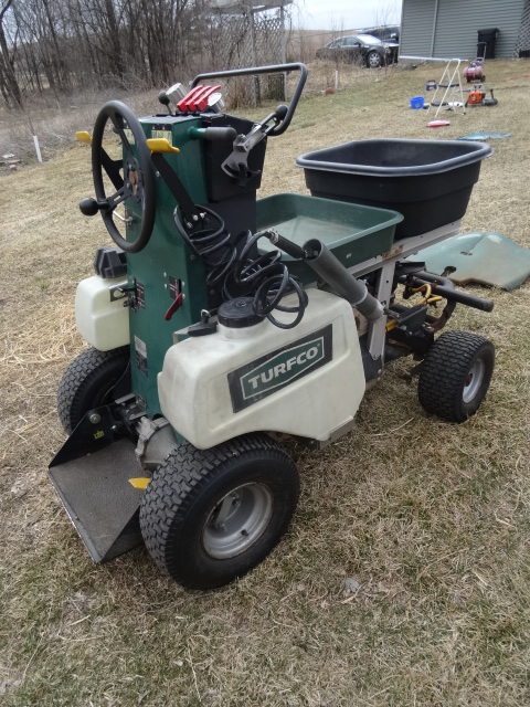 lot 4 image: Turfco ride on fertilizer  lawn sprayer unit.