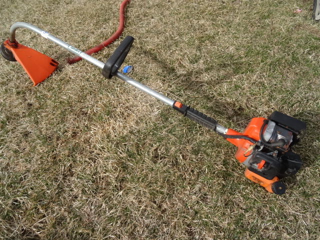 lot 9 image: Tanaka TBC-200 weed whip. 2 cycle.