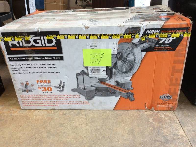 lot 37 image: Ridgid 12 in Dual Bevel sliding miter saw never used