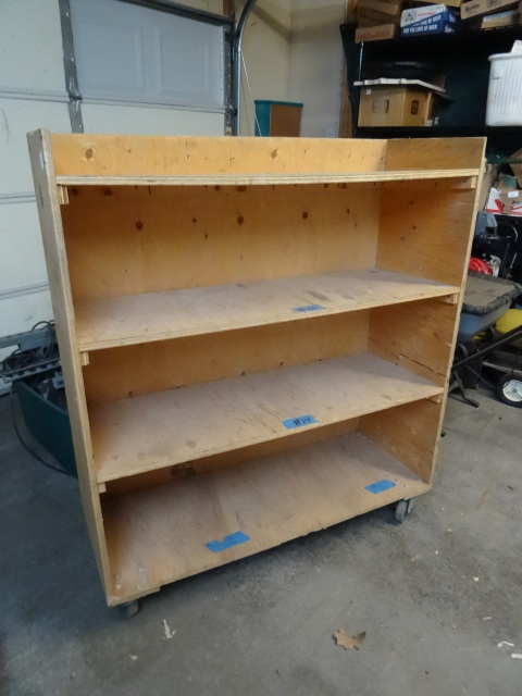 4 tier wood cabinet on wheels. Grea...