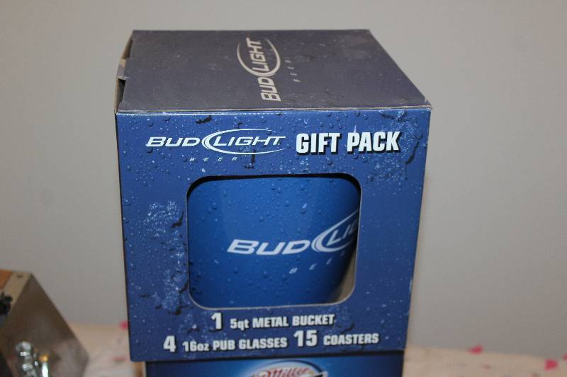 lot 22 image: Bud Light Gift Pack w 5-Quart Ice Bucket, 4-16oz. Pub Glasses, 15-Coasters