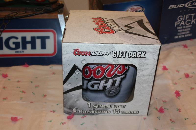 lot 23 image: Coors Light Gift Pack w 5-Quart Ice Bucket, 4-16oz. Pub Glasses, 15-Coasters