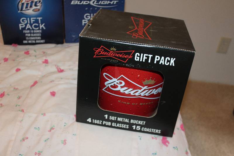 lot 24 image: Budweiser Gift Pack w 5-Quart Ice Bucket, 4-16oz. Pub Glasses, 15-Coasters