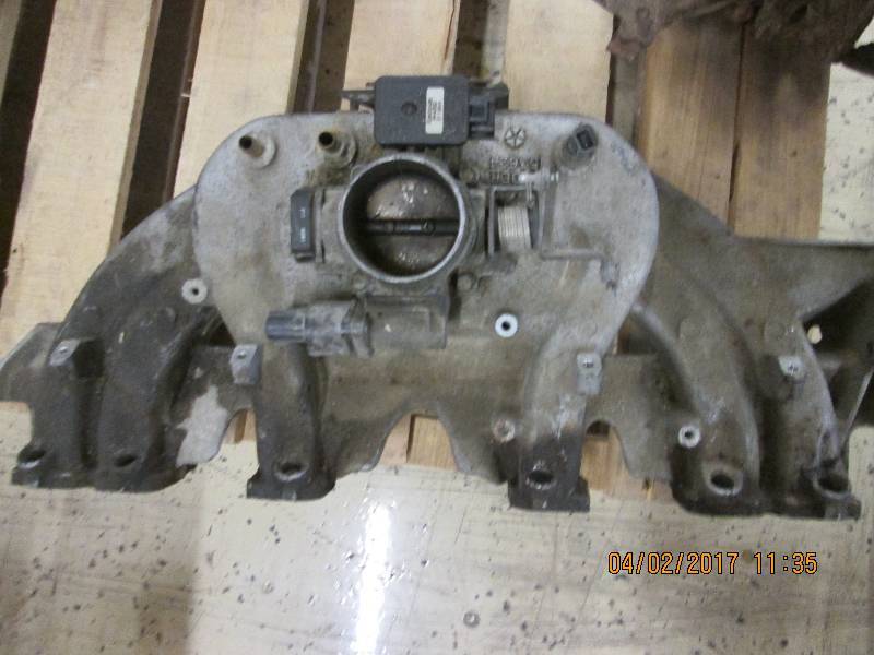lot 16 image: throttle body and injection believe...