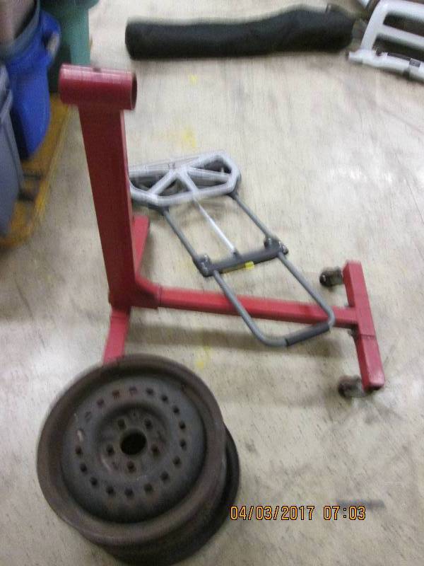 lot 26 image: folding cart,steel rims, and engine...