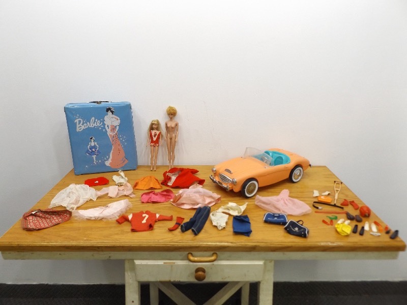 lot 22 image: AUTHENTIC Vintage Bubble Cut Hair Barbie, Skipper, 1962 Barbie Austin Healy Roadster, etc.