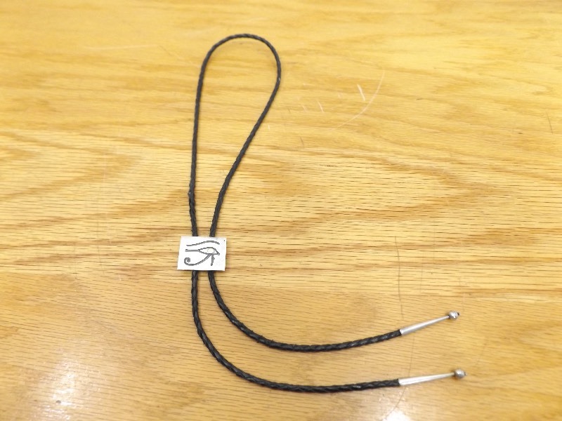 lot 39 image: Leather Bolo Tie with Sterling Silver Pendant, Tips, and Clasp (.815 oz Total Weight)