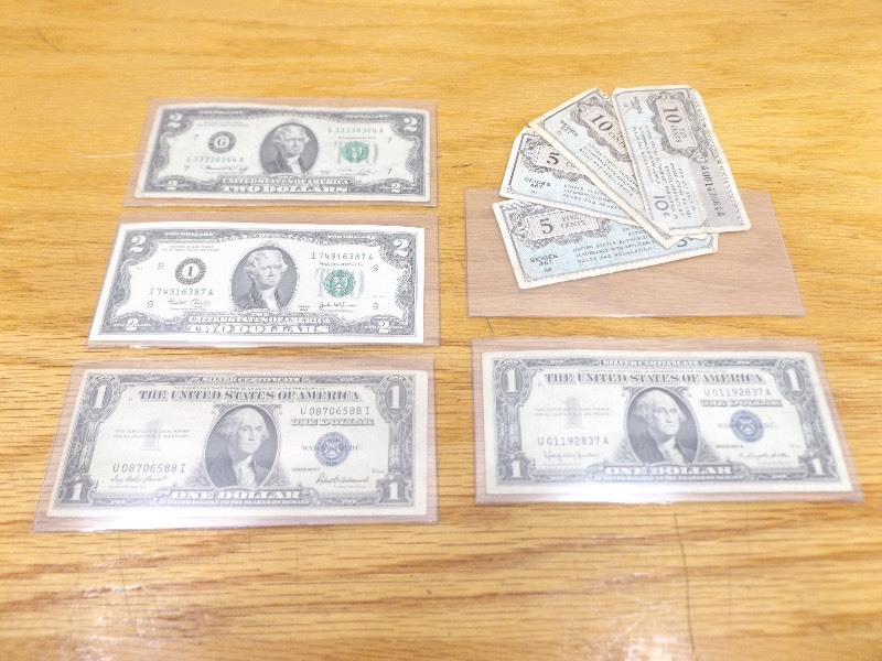 lot 43 image: Lot of 2 - $2 Silver Certificates, 2 - $1 Silver Certificates, and 4 - Military Payment Certificates