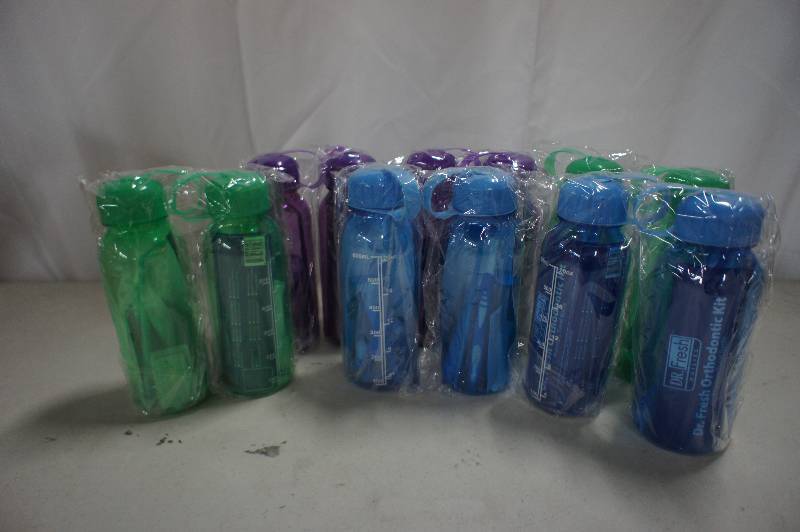 lot 140 image: Lot of 12 Assorted Bottles of  Dr Fresh Orthodontic Kit Premium Travel Bottles - Assorted Colors