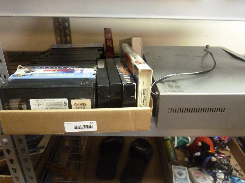 lot 84 image: VHS Movies and VCRDVD Combo Player