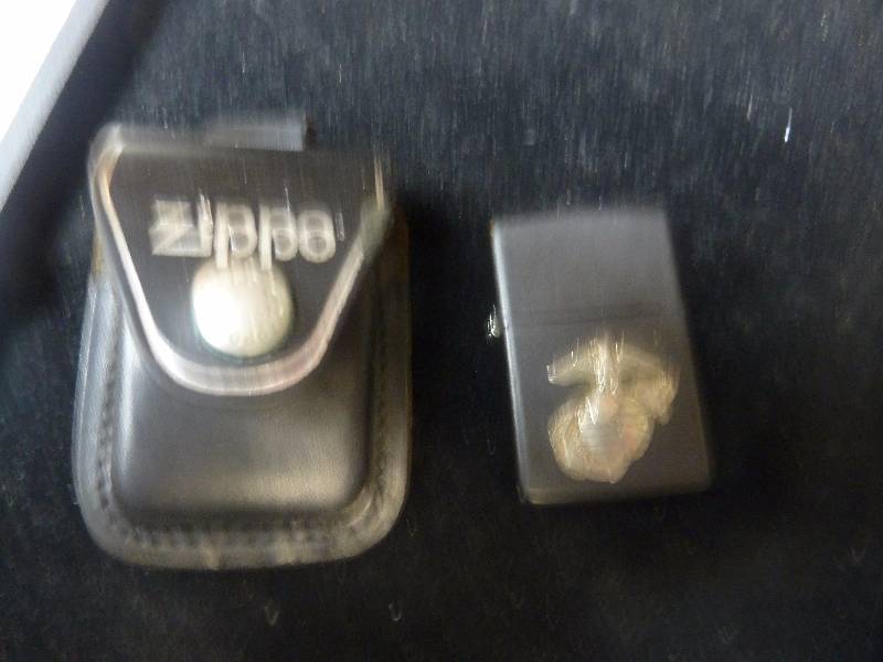 lot 107 image: Marine Zippo Lighter and Leather Zippo Holder