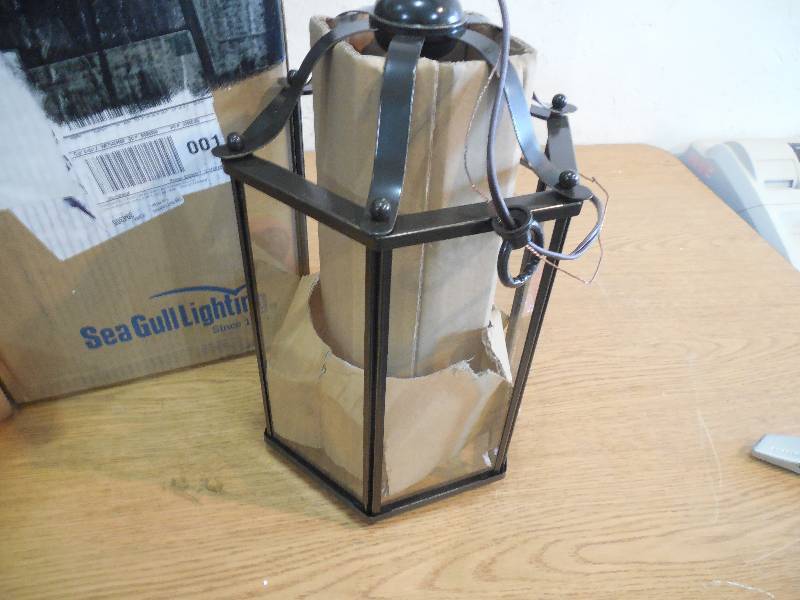 lot 35 image: Sea Gull Lighting Bretton 3-Light Heirloom Bronze Semi Flushmount