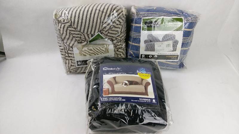 lot 19 image: Sure Fit Grainsack Stripe T-Cushion Loveseat Cover, Sure Fit Quilted Duck Pet Loveseat Cover, and Sure Fit Ticking Stripe Loveseat Slipcover