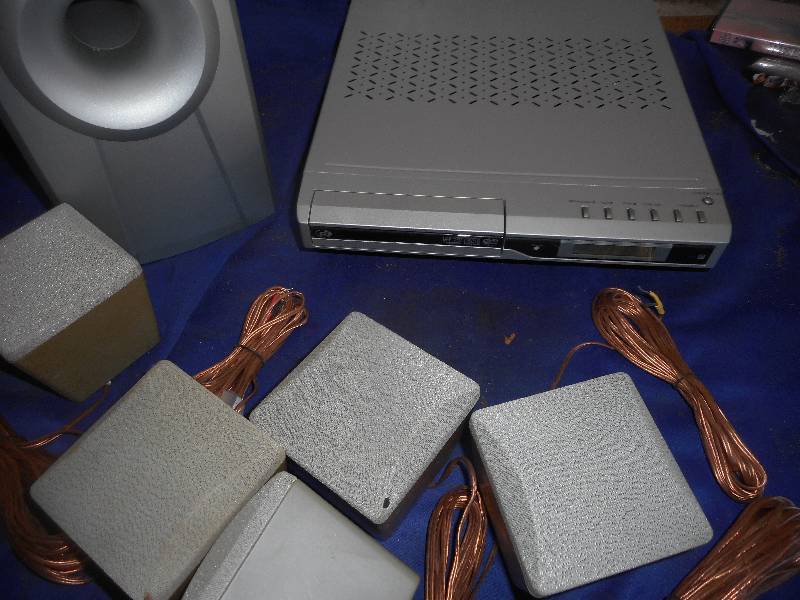 DVD PLAYER , SPEAKERS , REMOTES AND HOOK UPS