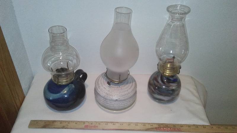lot 12 image: Oil lamps (3) Shades of Blue, perfect for when the electricity goes out.