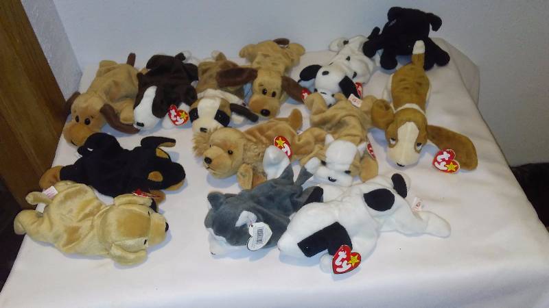 lot 55 image: Canine Beanie Babies (14) most with Heart Tags, All with Tush Tags, Display Only, Never Played with.