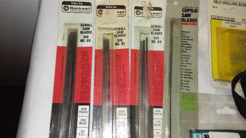 lot 129 image: Delta Rockwell Scroll Saw Blades, new screen door spring, cable tie mounts and more