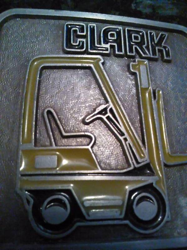 lot 274 image: Vintage Belt Buckle, Clark Forklift with resin colored lift, Silver color