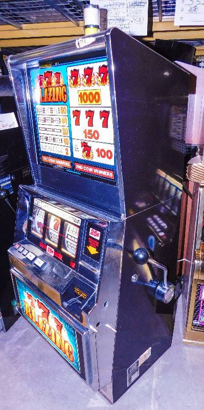 lot 1011 image: BALLY BLAZING SEVENS REEL SLOT MACHINE