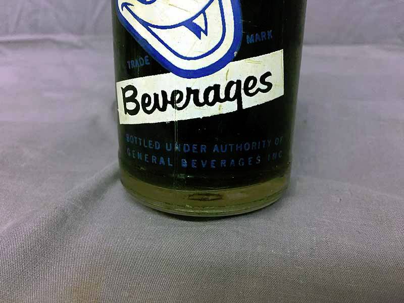 lot 62 image: Donald Duck Cola NOS bottle