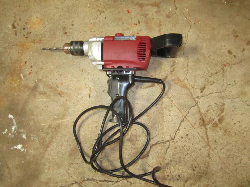 lot 3 image: Reversible electric drill...
