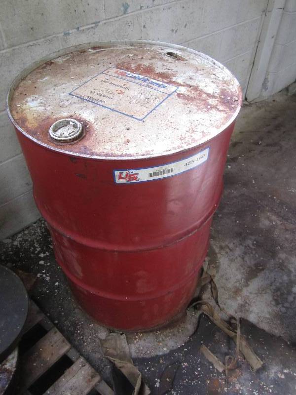 lot 17 image: Red 55 gallon metal drum...