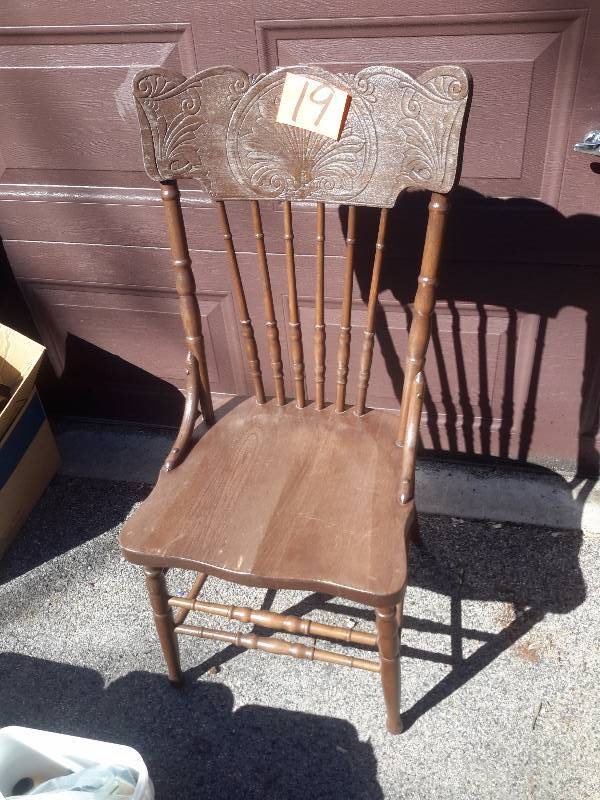 2 vintage spindle back chairs with nice carved design.
