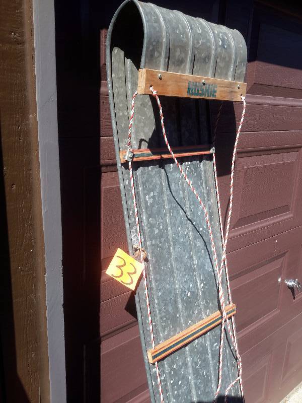 Galvanized metal tobbagon with pad (pad needs work).