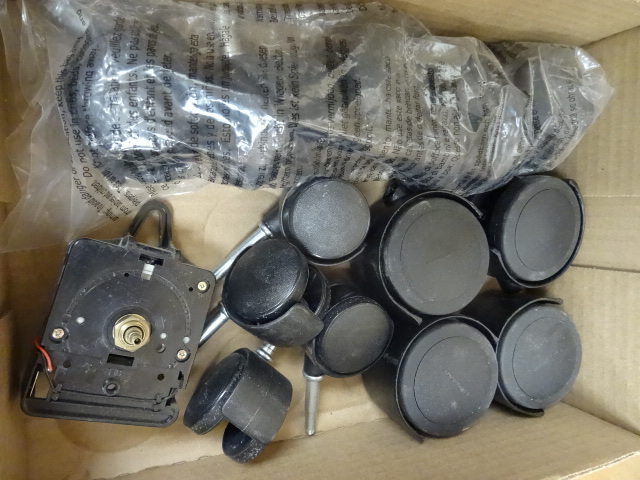 lot 44 image: Misc casters. Battery powered clock...