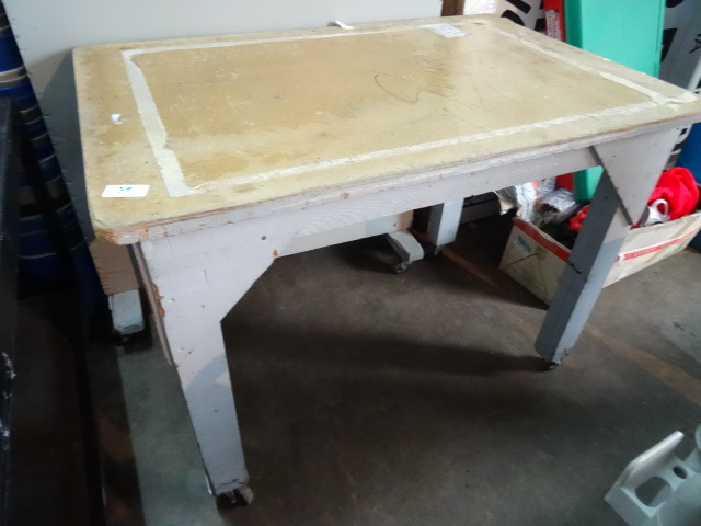 Wood table on wheels. 32 x 48 x 36...