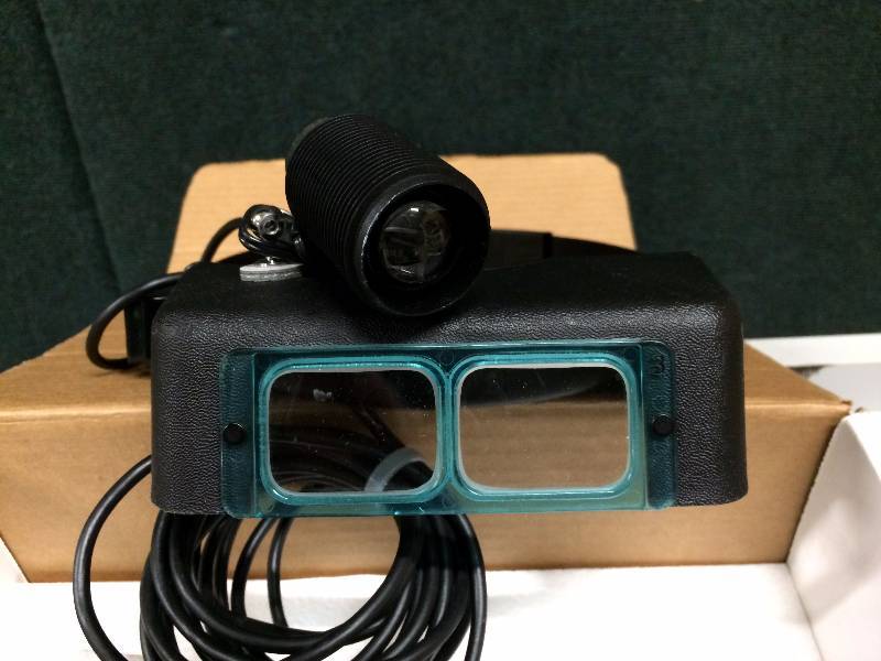 lot 9 image: Looks New Optivisor Light Tech Physicians Surgical Headlight Headband Magnifier Lighted Glass Optivisor Binocular Use Also for Hobby Jewelry Repair Reading Etc