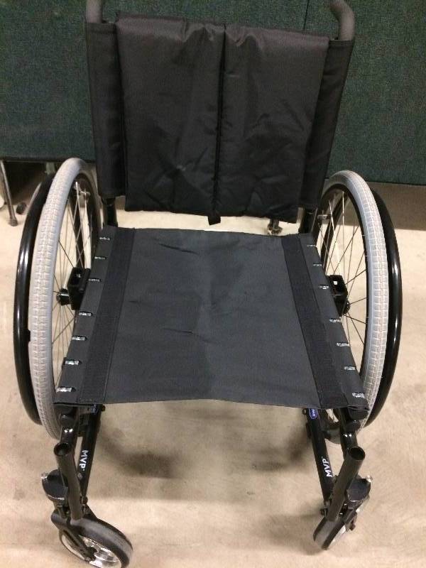 lot 72 image: RETAILS for $1300 INVACARE MVP Wheel Chair Sporty Black Powder Coated Arms Have Been Removed For Better Mobility